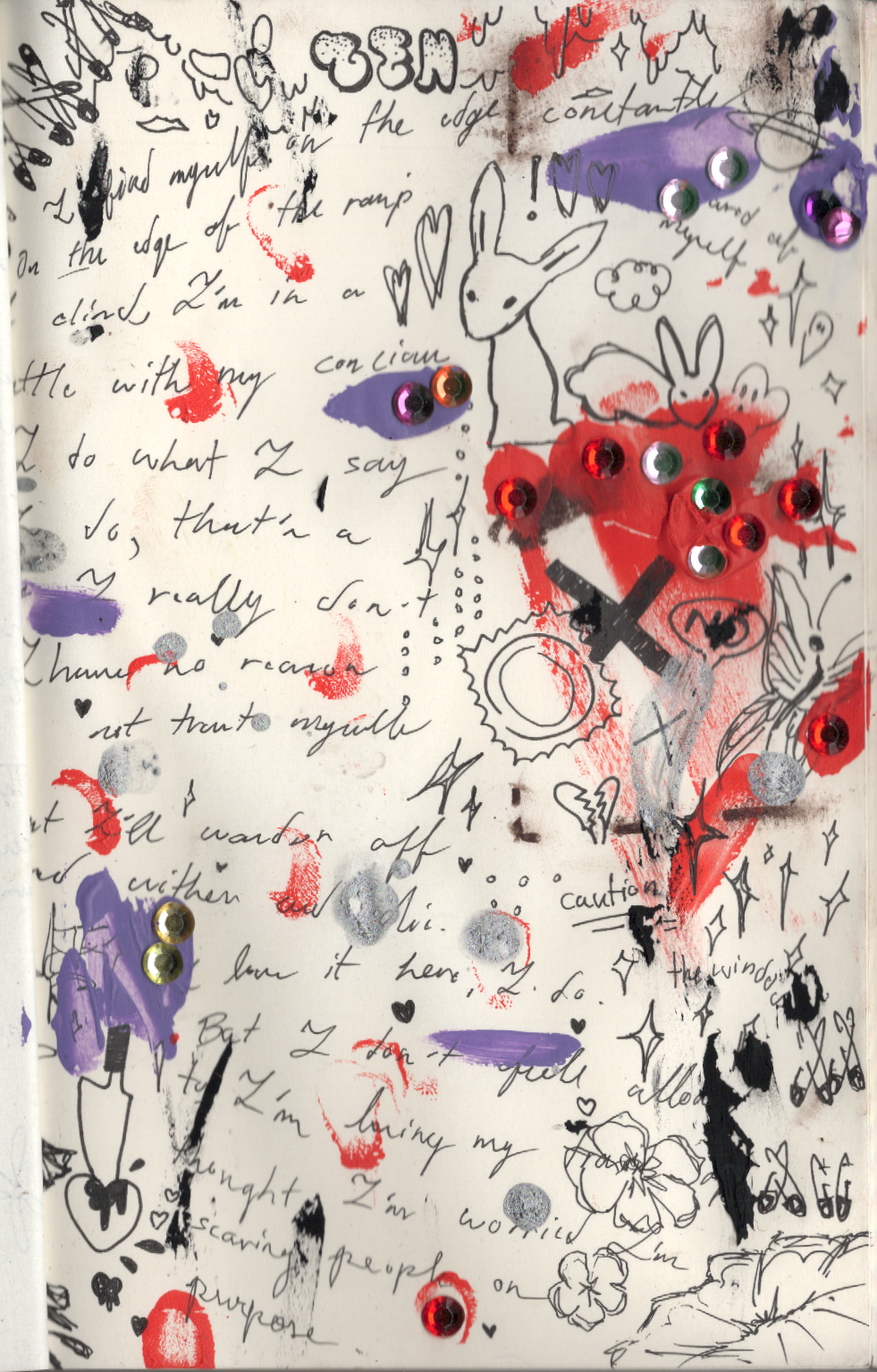 journal entry covered in script doodles and paint